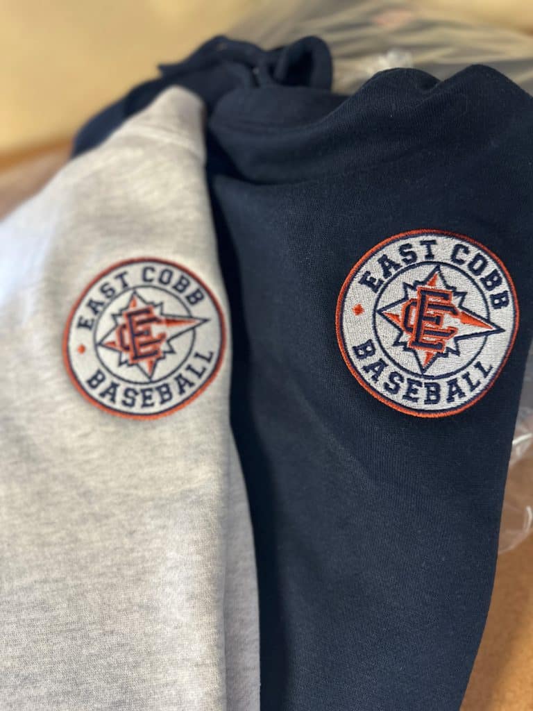East Cobb Baseball embroidered patches, close-up of two jackets with team logos.